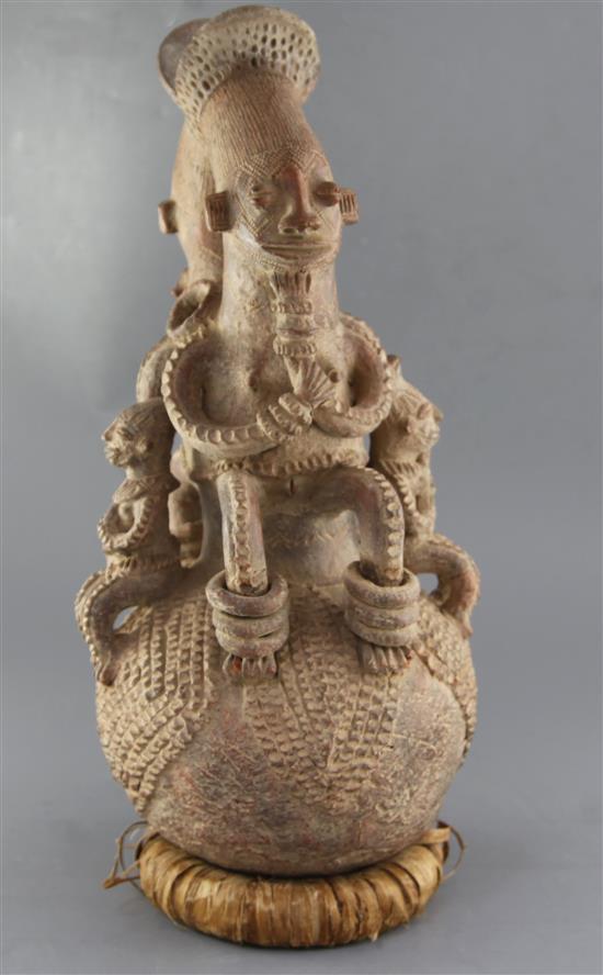 A Mangbetu People of the Congo large Royal terracotta pot, surmounted with four seated figures, 55cm